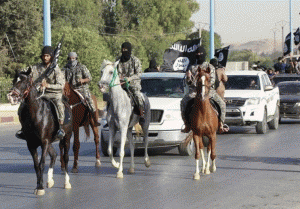 Islamic State militants parade in Mosul